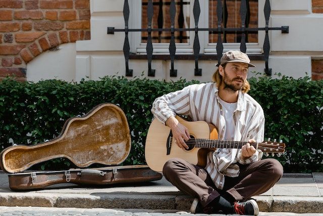 What is busking in music?