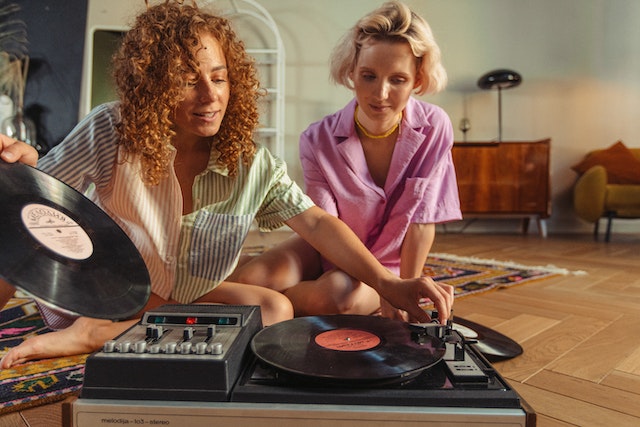 Two women listening to music together
